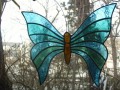 Vitrážový motýl zelenomodrý