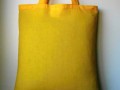Žlutá taška s mandalami a razítky